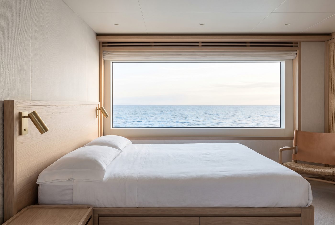 Master cabin aboard MISTRAL with a wide window onto the sea